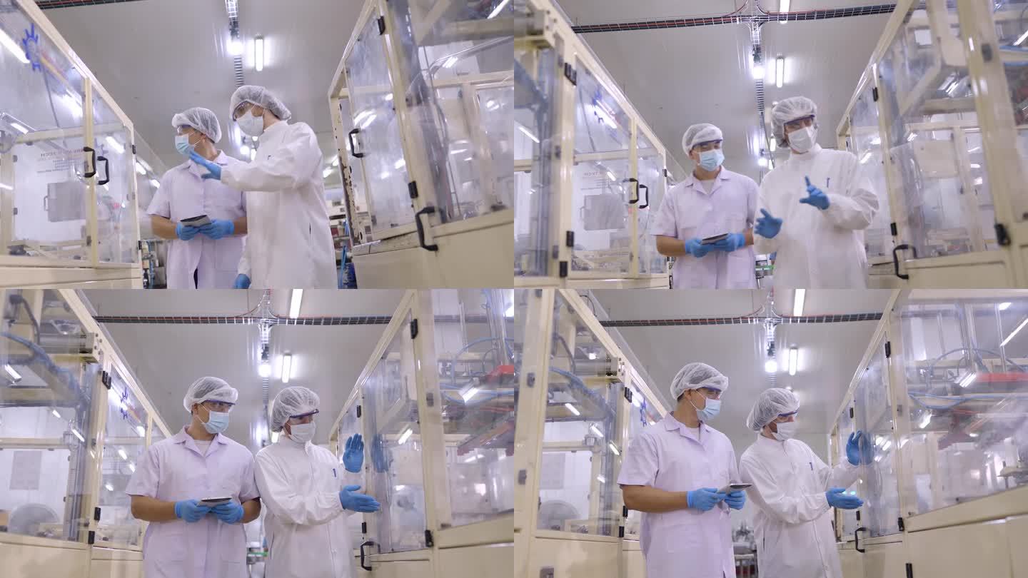 工程師或技術人員穿著防護服檢查電子零件、食品產品或化妝品制造廠的機器準備情況。維護團隊檢查工廠的公用